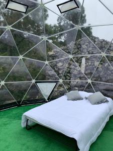 Postel nebo postele na pokoji v ubytování SkyDome