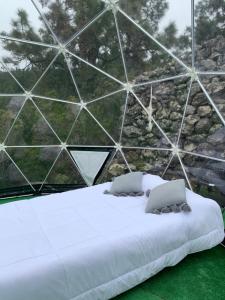 Postel nebo postele na pokoji v ubytování SkyDome