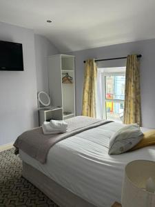 Postel nebo postele na pokoji v ubytování The Cosy Cottage + 22 fotografií