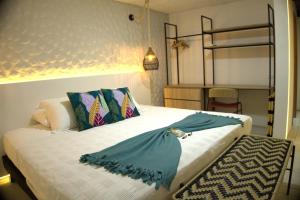 a bedroom with a large bed with a pillow on it at Cannatel Exclusive Hotel in Armenia