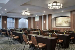 a conference room with tables and chairs and chandeliers at Sol Cypress, San Antonio, a Tribute Portfolio Hotel in San Antonio +51 photos