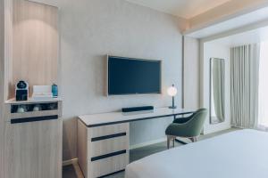 Uma TV ou centro de entretenimento em Vignette Collection SOUMA Hotel by IHG