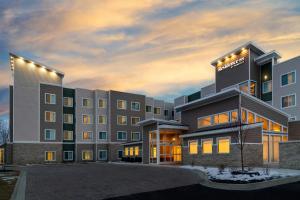 a rendering of a hotel at dusk at Residence Inn by Marriott Detroit Dearborn in Dearborn