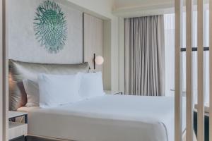 Cama ou camas em um quarto em Vignette Collection SOUMA Hotel by IHG