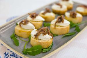 a tray of food with appetizers on a table at Hotel St Gregory Park in Rimini