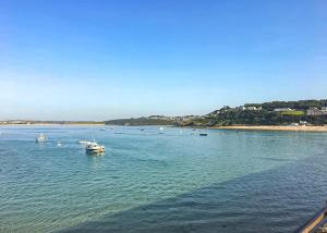 a large body of water with boats in it at Stream Valley Holiday Park in Penzance +13 photos