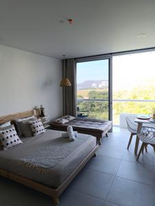 Postel nebo postele na pokoji v ubytování Lindo apto con vista al mar Santa Marta