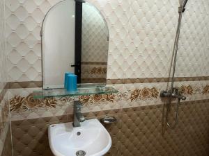 a bathroom with a sink and a mirror at Công Thành hotel in Lao Cai