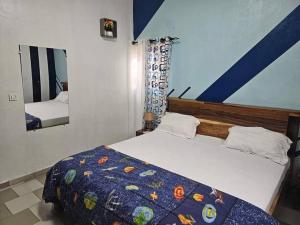 Una cama o camas en una habitación de Résidence meublée Yamoussoukro