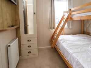 Ένα ή περισσότερα κρεβάτια σε δωμάτιο στο Hazel Park Lodge HP4