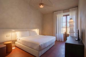 Postel nebo postele na pokoji v ubytování Casa Ruffino - Wine Relais