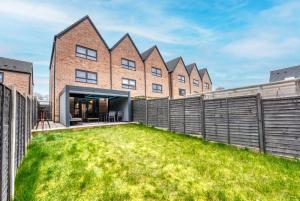 an exterior view of a house with a yard at Spacious 4 BR House w/Parking in Birmingham