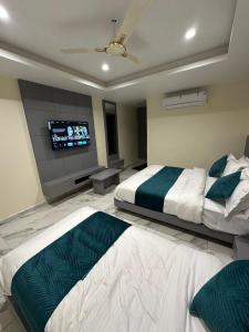 Postel nebo postele na pokoji v ubytování Hotel Shyam Paradise
