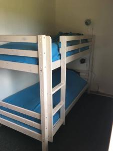 a pair of bunk beds in a room at Privat hus mellem Legoland og Givskud Zoo in Gadbjerg