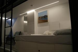 Postel nebo postele na pokoji v ubytování M Pods Malaga