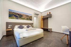 Ad Maiora - Design Rooms客房内的一张或多张床位