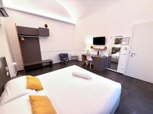 Ad Maiora - Design Rooms客房内的一张或多张床位