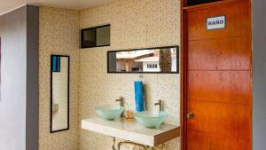 Et badeværelse på Casa de Playa Ocean Blue SV