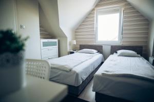 Postel nebo postele na pokoji v ubytování Guest House Family