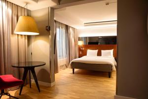 Łóżko lub łóżka w pokoju w obiekcie Radisson Blu Arlandia Hotel, Stockholm-Arlanda