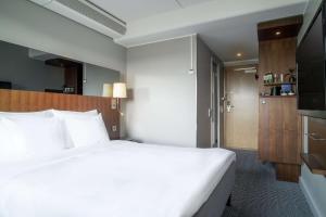 Łóżko lub łóżka w pokoju w obiekcie Radisson Blu Arlandia Hotel, Stockholm-Arlanda
