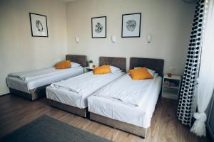 Postel nebo postele na pokoji v ubytování Guest House Family