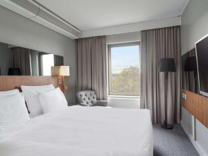 Łóżko lub łóżka w pokoju w obiekcie Radisson Blu Arlandia Hotel, Stockholm-Arlanda
