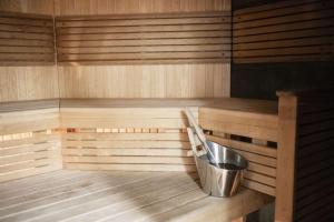 a small sauna with a bucket in it at Radisson Blu Arlandia Hotel, Stockholm-Arlanda in Arlanda +56 photos