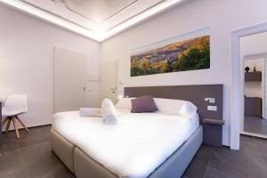 Ad Maiora - Design Rooms客房内的一张或多张床位