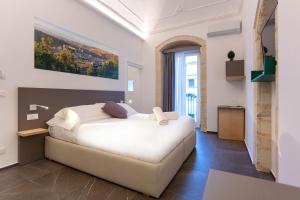 Ad Maiora - Design Rooms客房内的一张或多张床位