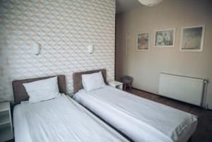 Postel nebo postele na pokoji v ubytování Guest House Family