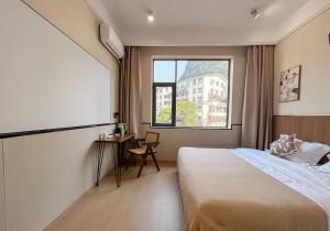 Ένα ή περισσότερα κρεβάτια σε δωμάτιο στο Taoshe Mountain Guesthouse