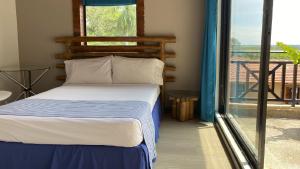 Postel nebo postele na pokoji v ubytování Hotel Girardot Resort by On Vacation + 31 fotografií