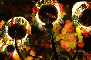 a group of lanterns are lit up at night at Cemil İpekçi Pension in Bodrum City