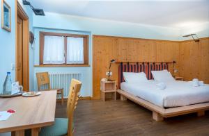 Voodi või voodid majutusasutuse Valbruna Inn Bed & Breakfast toas