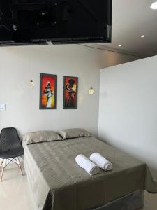 Postel nebo postele na pokoji v ubytování Acorde com Vista para o Rio no Centro de Manaus + 13 fotografií