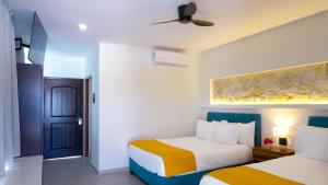 Postel nebo postele na pokoji v ubytování Hotel Loreto Palmar