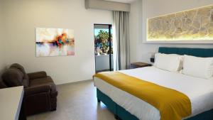 Postel nebo postele na pokoji v ubytování Hotel Loreto Palmar