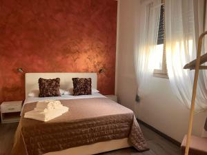 Postel nebo postele na pokoji v ubytování Harmony Lake Sirmione