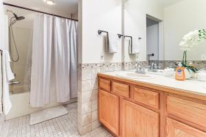a bathroom with a sink and a shower at 5 Mi to EMU Home with Seasonal Pool Access in Lincoln +22 photos