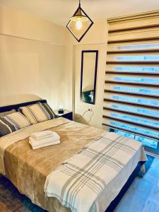 Postel nebo postele na pokoji v ubytování Izmir Home & Garden