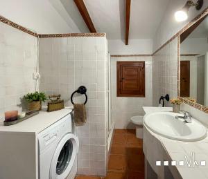 a bathroom with a washing machine and a sink at VH Costa Blanca - MATIMI in Benissa +62 photos