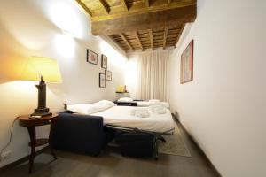 Postel nebo postele na pokoji v ubytování Appartamento Roma Coronari Suite