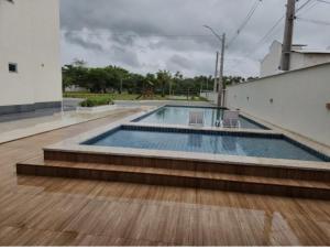 a swimming pool on top of a building at Apartamento Beira-Rio in Barreirinhas +29 photos