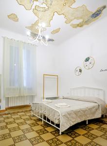 a bedroom with a bed and a map on the wall at CasaLù in Bari