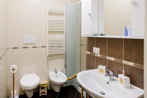 a bathroom with a toilet and a sink at CasaLù in Bari