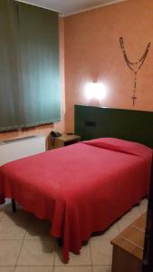 Postel nebo postele na pokoji v ubytování Hotel Armida