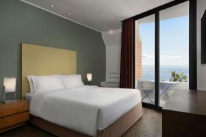 Un ou plusieurs lits dans un hébergement de l'établissement Four Points by Sheraton Catania Hotel