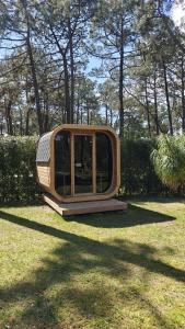 a small house sitting on the grass in a field at 5br Golf & Pool Villa in Caparica | By Airnest in Aroeira