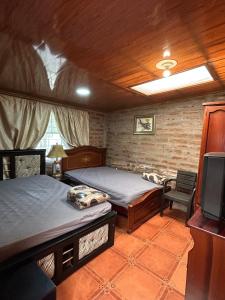 Postel nebo postele na pokoji v ubytování Quinta Paraíso Escondido